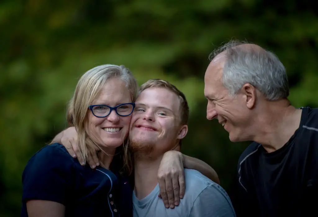 family smiling to the camera